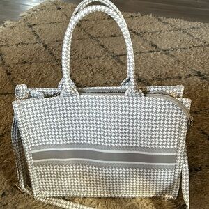 Gray checkered and striped bag